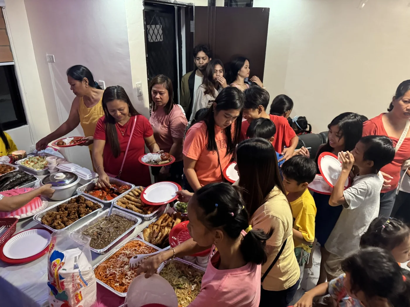 Families and ministry partners sharing a community meal together