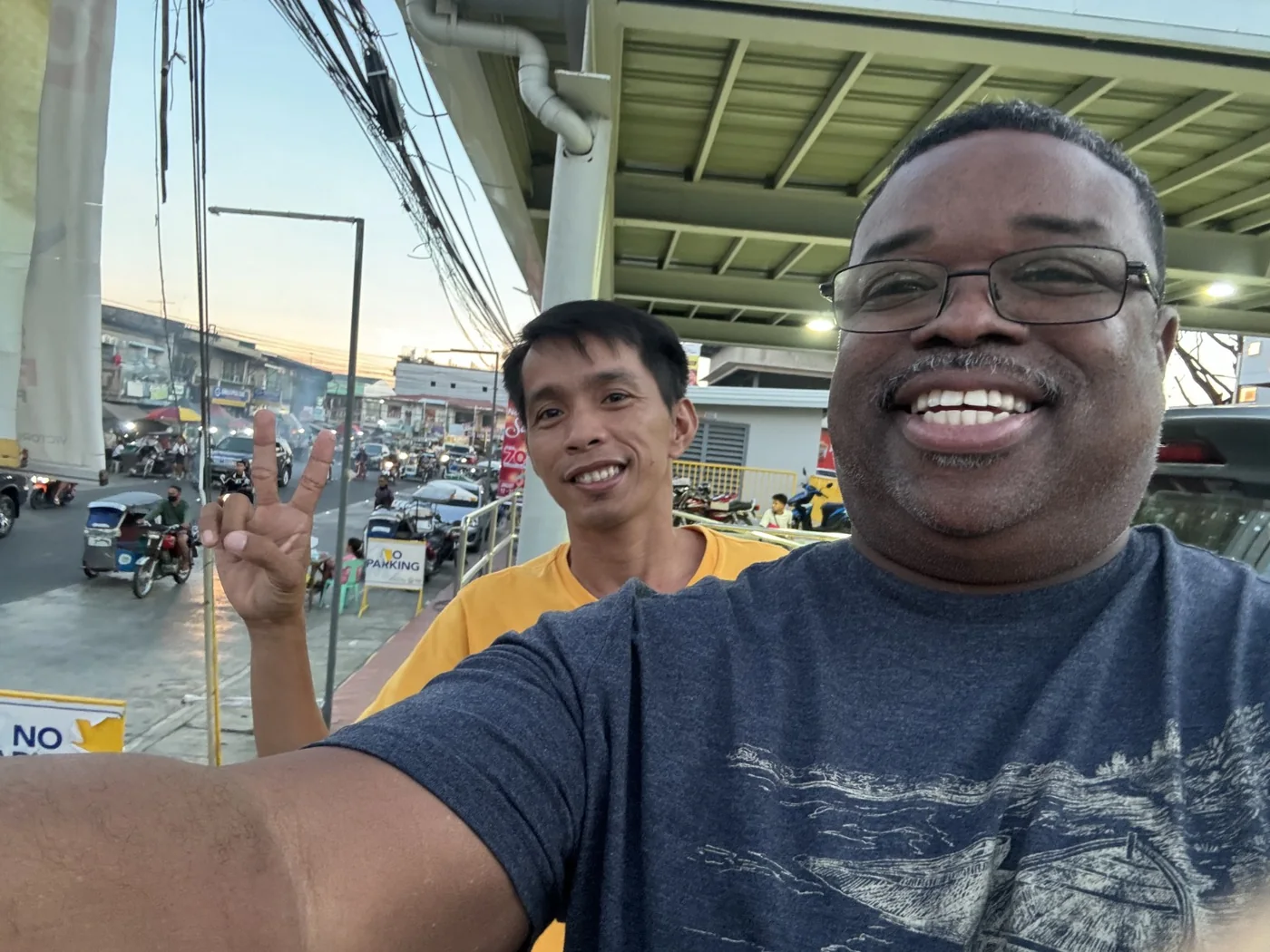 Two ministry partners smiling together during an international mission visit