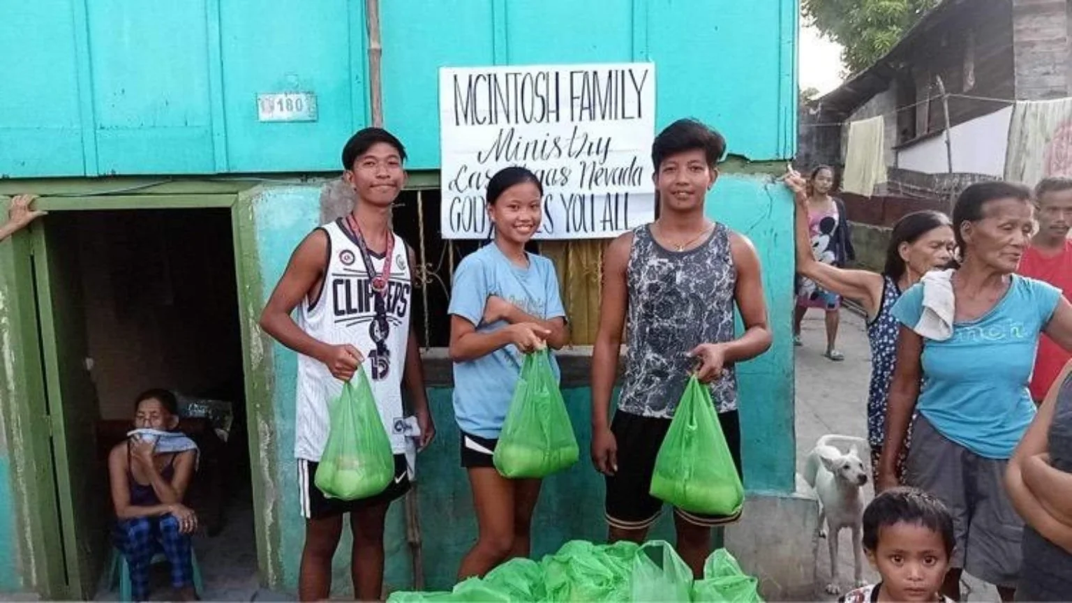 Local community members receiving food relief during a Kingdom Missions International outreach